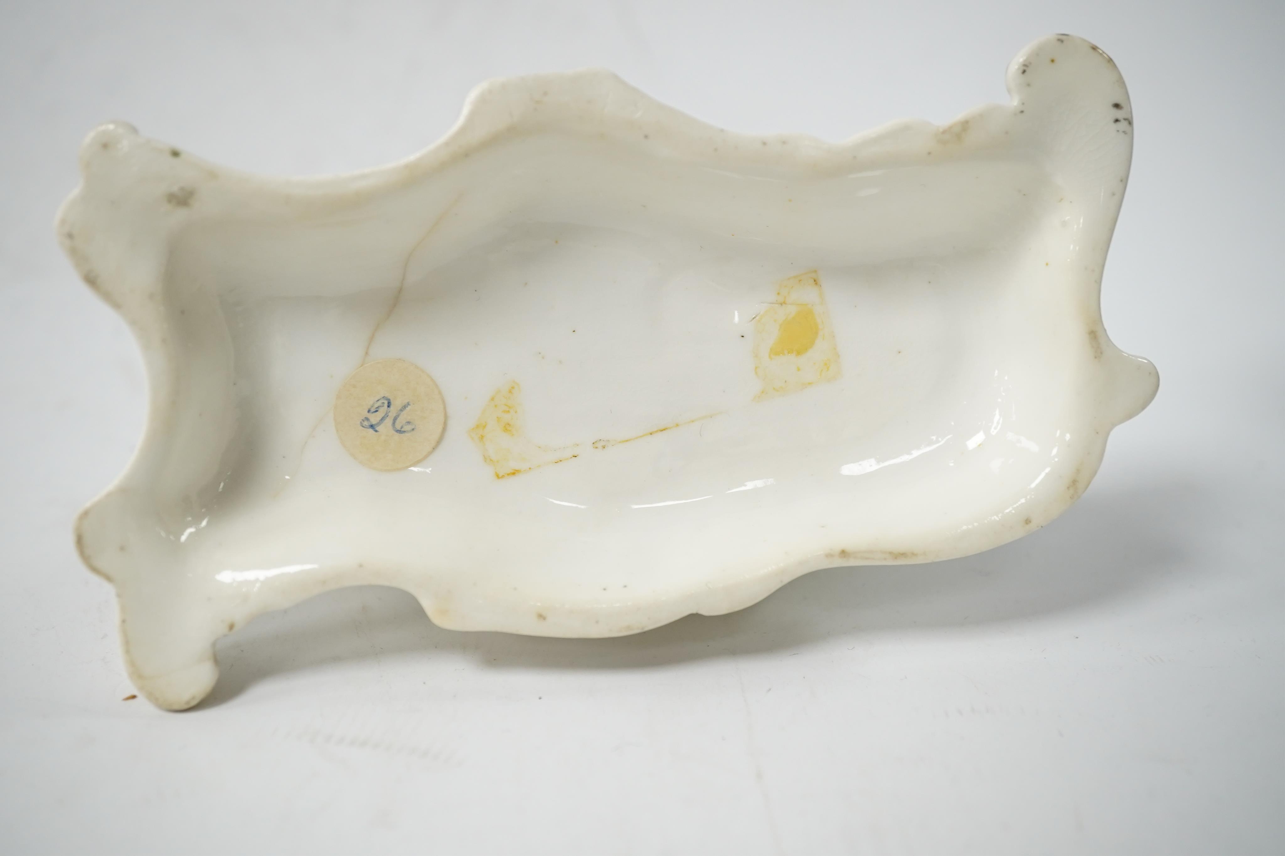 Five rare Staffordshire porcelain models of cats, circa 1830-50, including a group of a cat and kitten, together with a pair of late Staffordshire porcellaneous cats, Condition - restoration to three of the cats and a cr